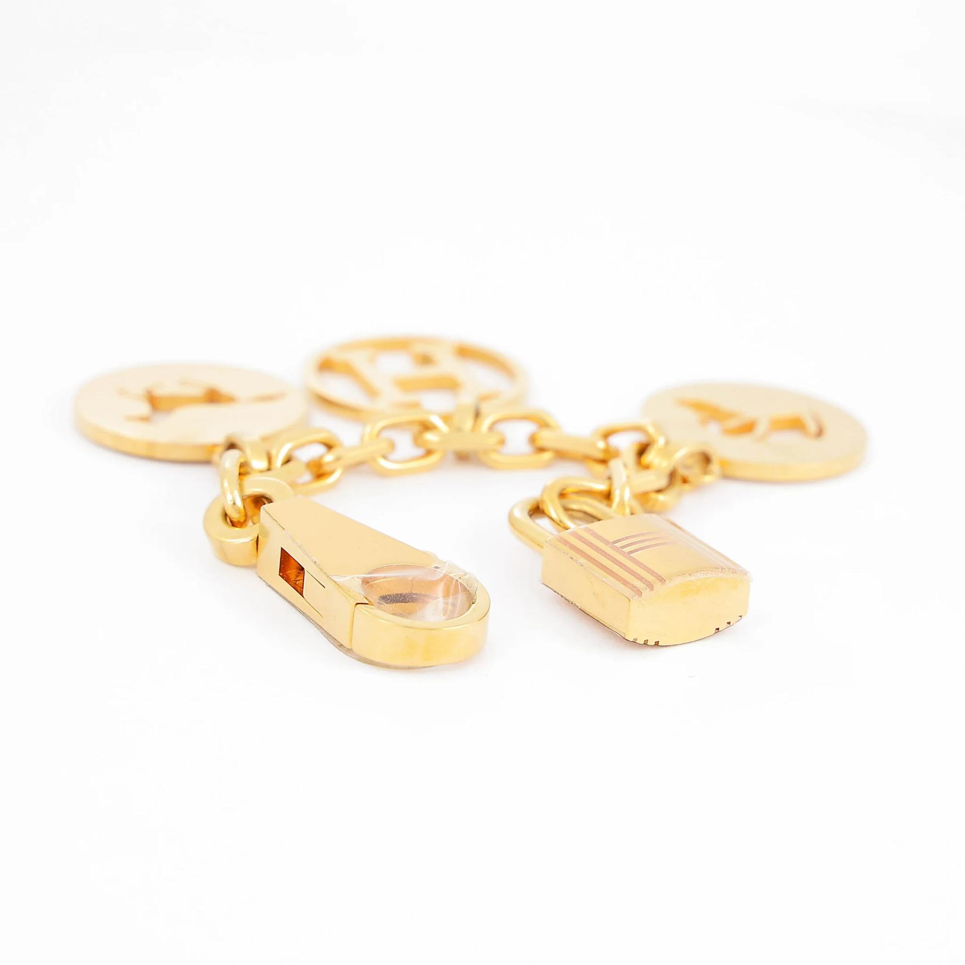 Very Good ( Rank A) HERMÈS Breloque Olga bag charm Gold Stainless steel Gold hardware - 5